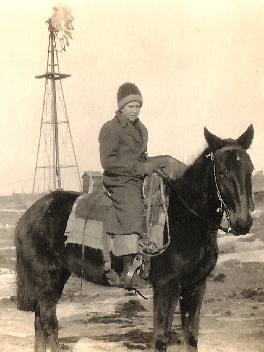 Edna M. "Myrle" Hawkins and her horse Rex / date unknown